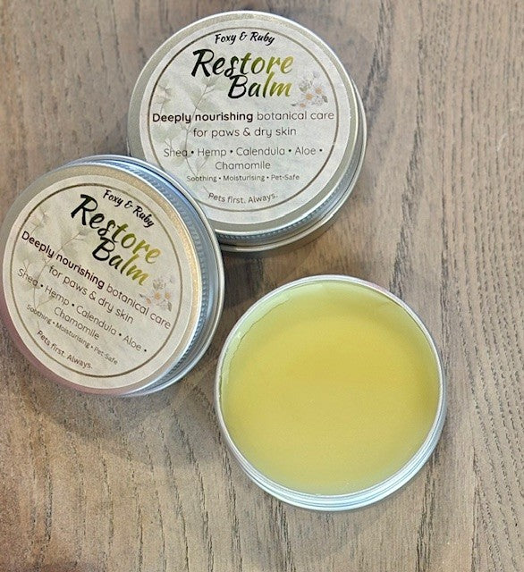 Natural dog paw balm tin with botanical ingredients for dry paws and skin