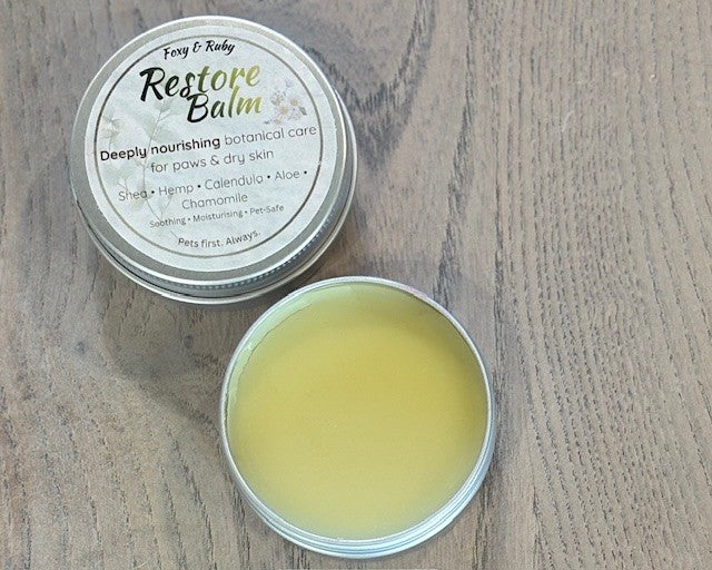 Natural dog paw balm tin with botanical ingredients for dry paws and skin