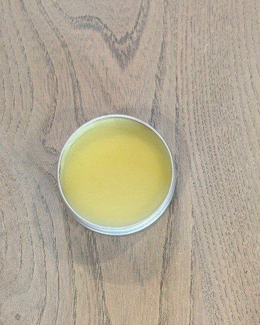 Natural dog paw balm tin with botanical ingredients for dry paws and skin