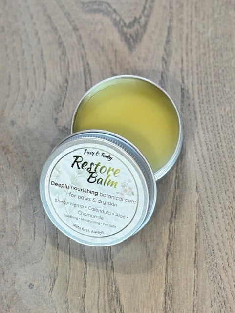 Natural dog paw balm tin with botanical ingredients for dry paws and skin