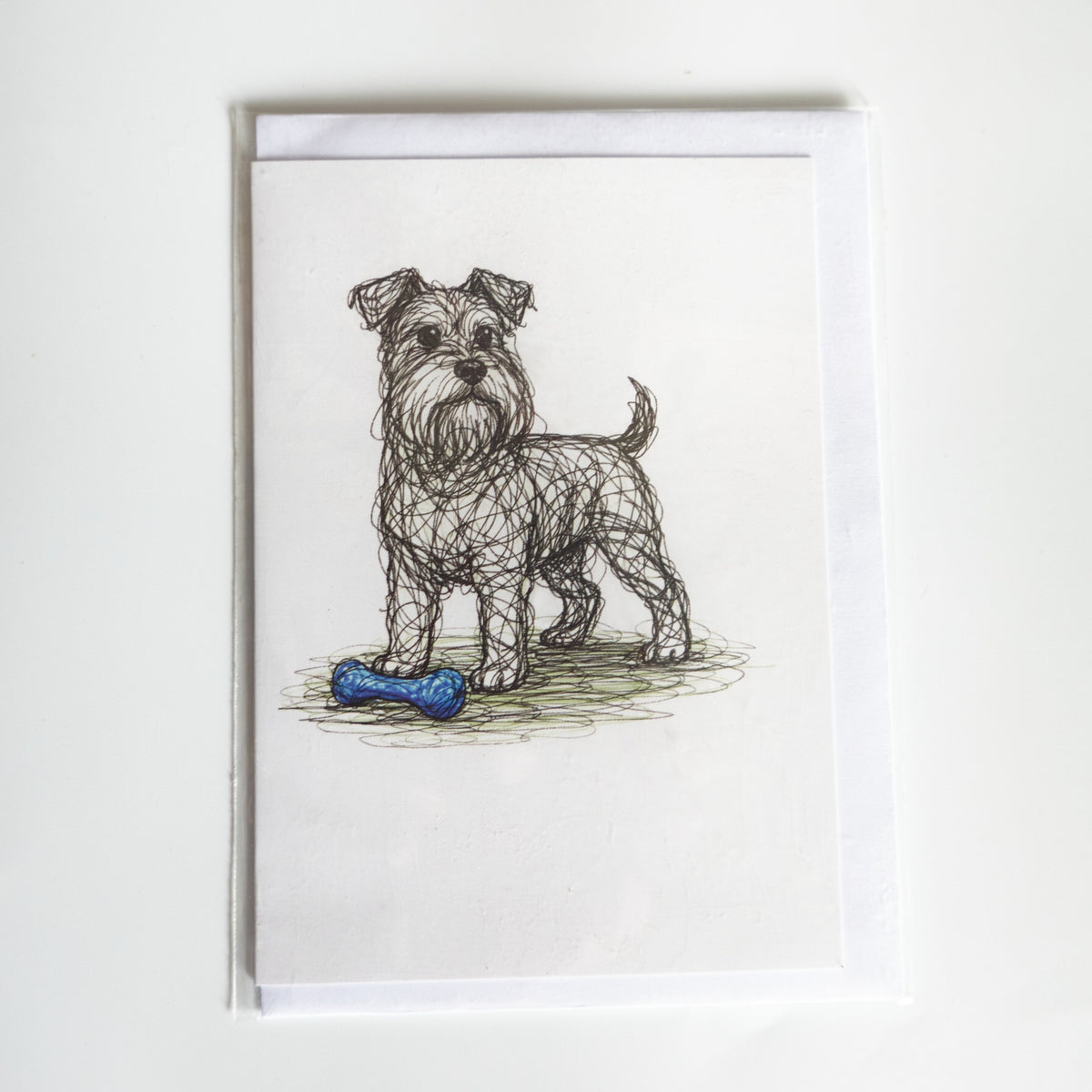 Illustrated Schnauzer greetings card with a blue bone and envelope